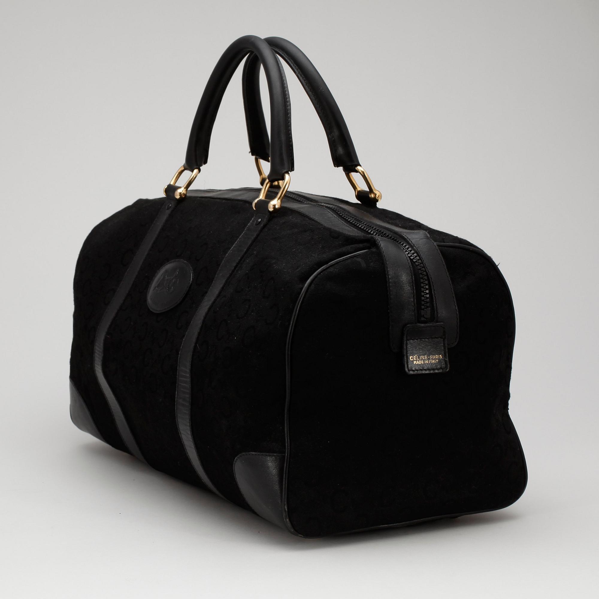 CÉLINE, a black canvas weekendbag.