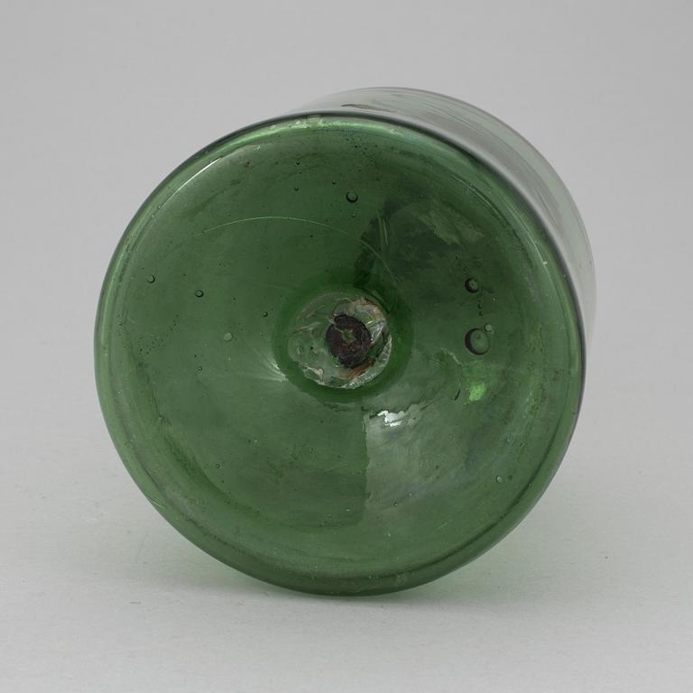 A 18th or 19th century glass bottle.