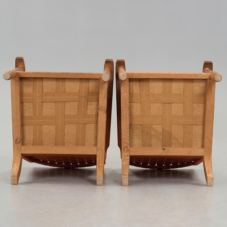 Axel Einar Hjorth, a pair of pine easy chairs, probably model 'Väddö' by Nordiska Kompaniet, Sweden 1930's.