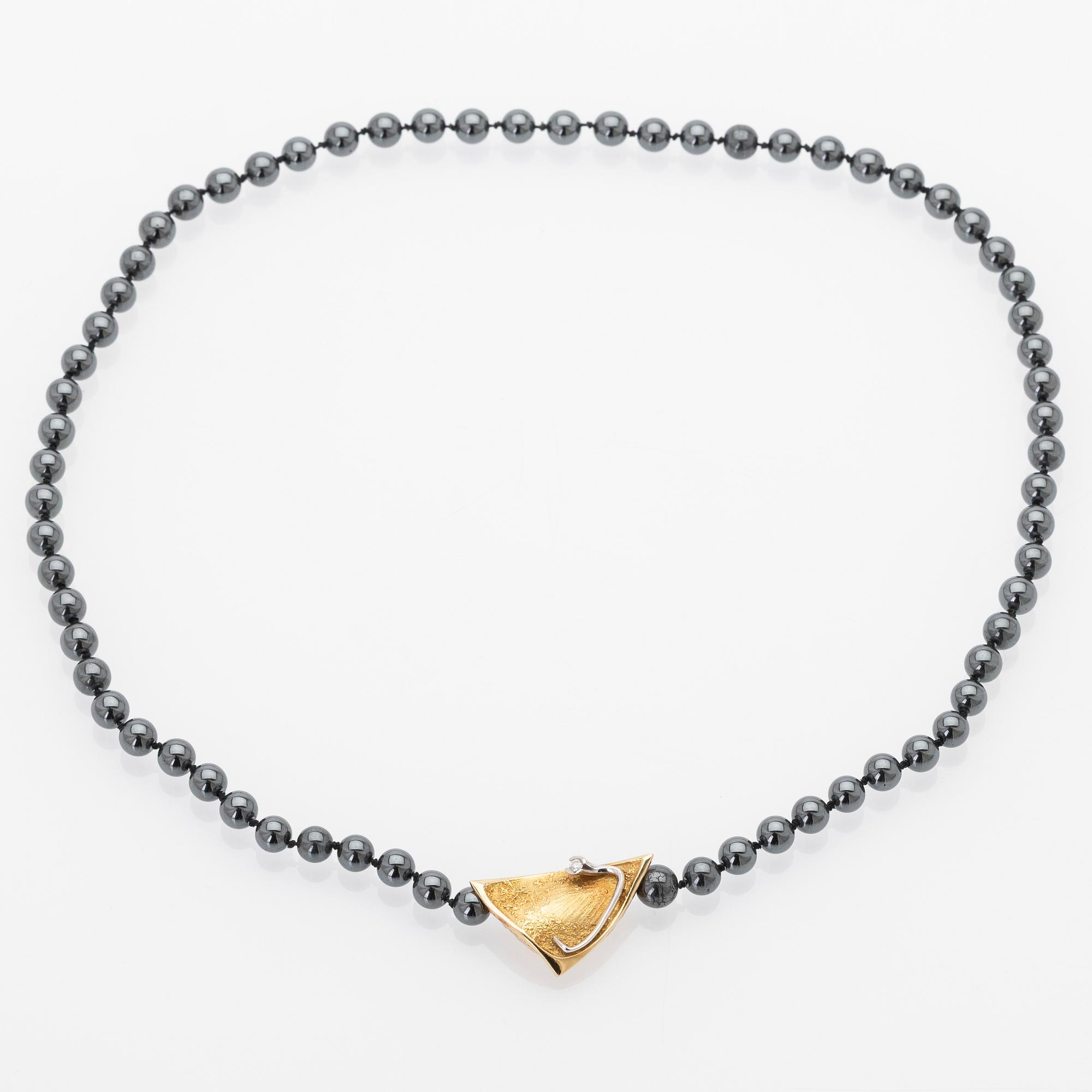 Ole Lynggaard, Hematite necklace with an 18K gold clasp and a diamond.