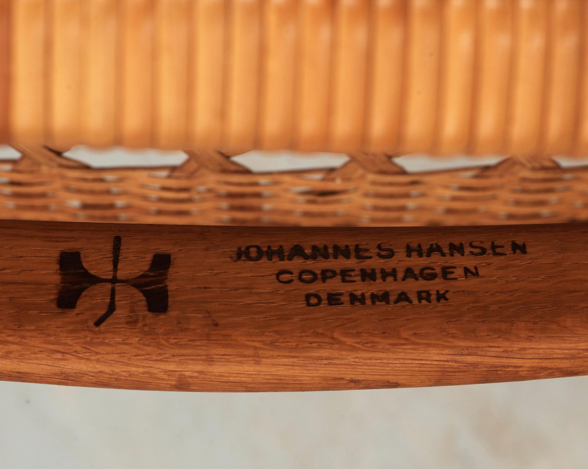 A Hans J Wegner oak and rattan folding chair, by Johannes Hansen, Denmark.