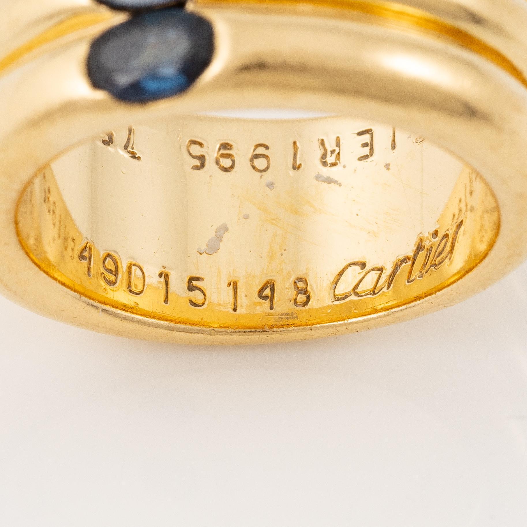 A Cartier ring "Ellipse" 18K gold with faceted sapphires.