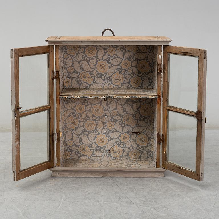 a wall-cabinet from the 19th century.