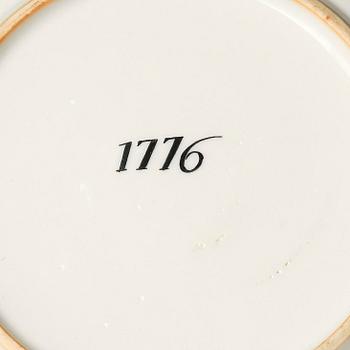 A famille rose armorial cup and stand with the monogram of the Swedish King Gustavus III, Qing dynasty, 18th century.