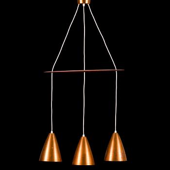 A 1960s three-shade copper and wood pendant ceiling light.