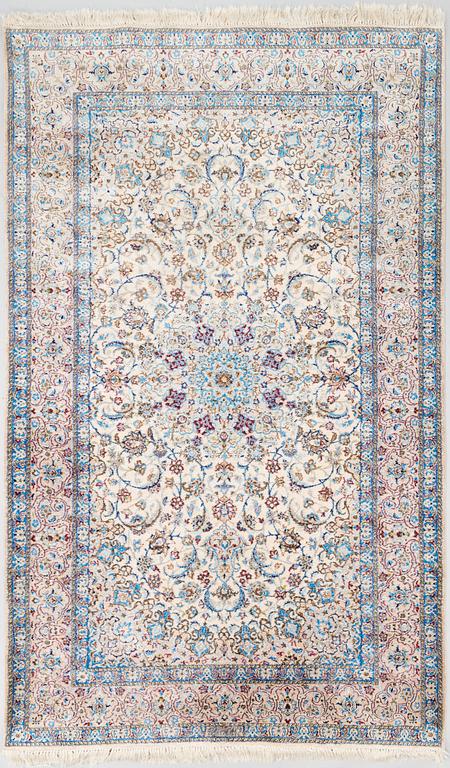 A oriental signed Nain silk carpet. Circa 267x163 cm.