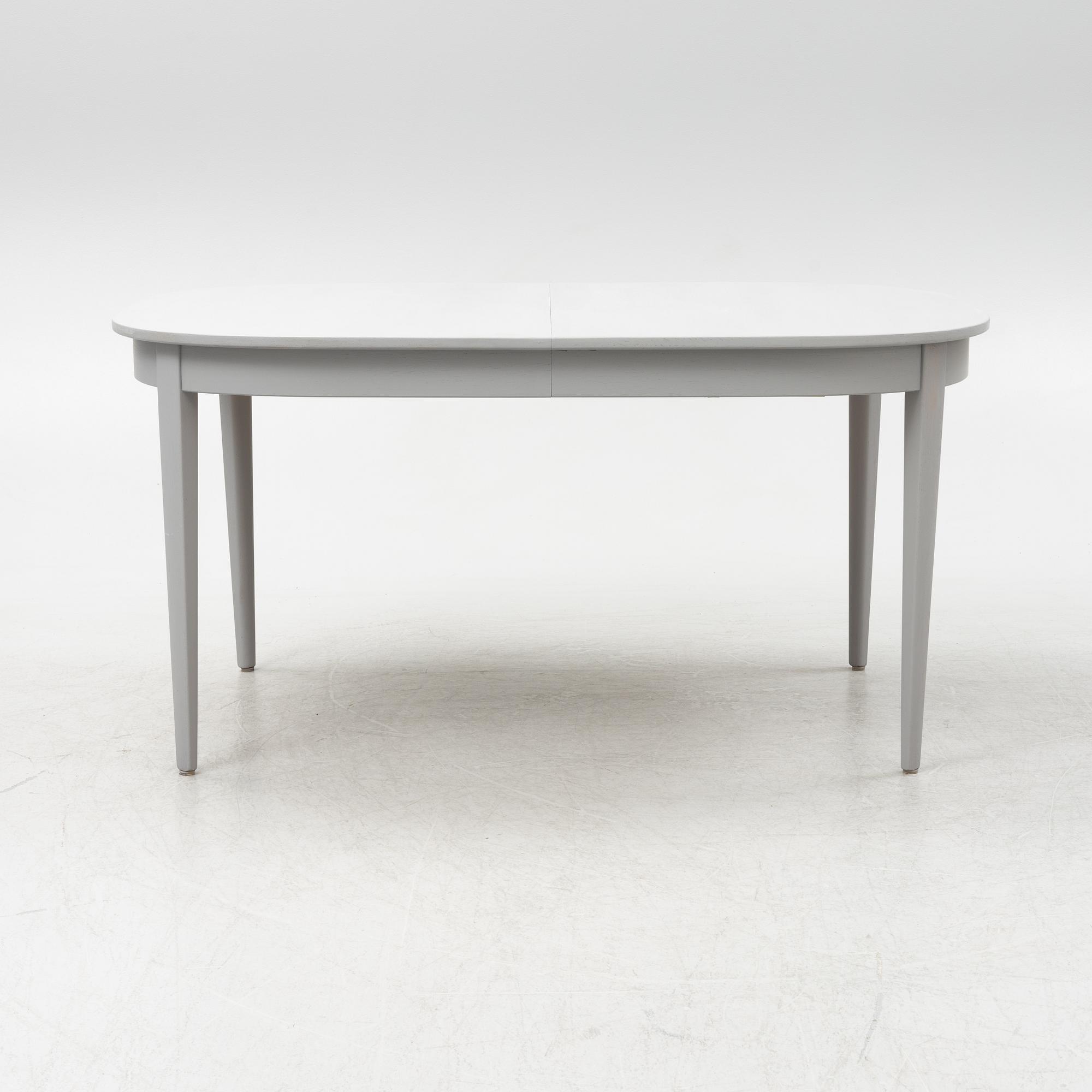 A Gustavian style dining table with twelve chairs, late 20th century.