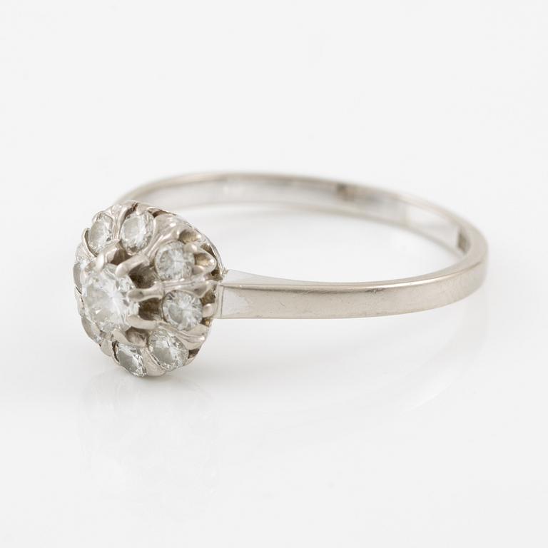A ring and a pair of earrings in 18K white gold set with round brilliant-cut and octagonal-cut diamonds.