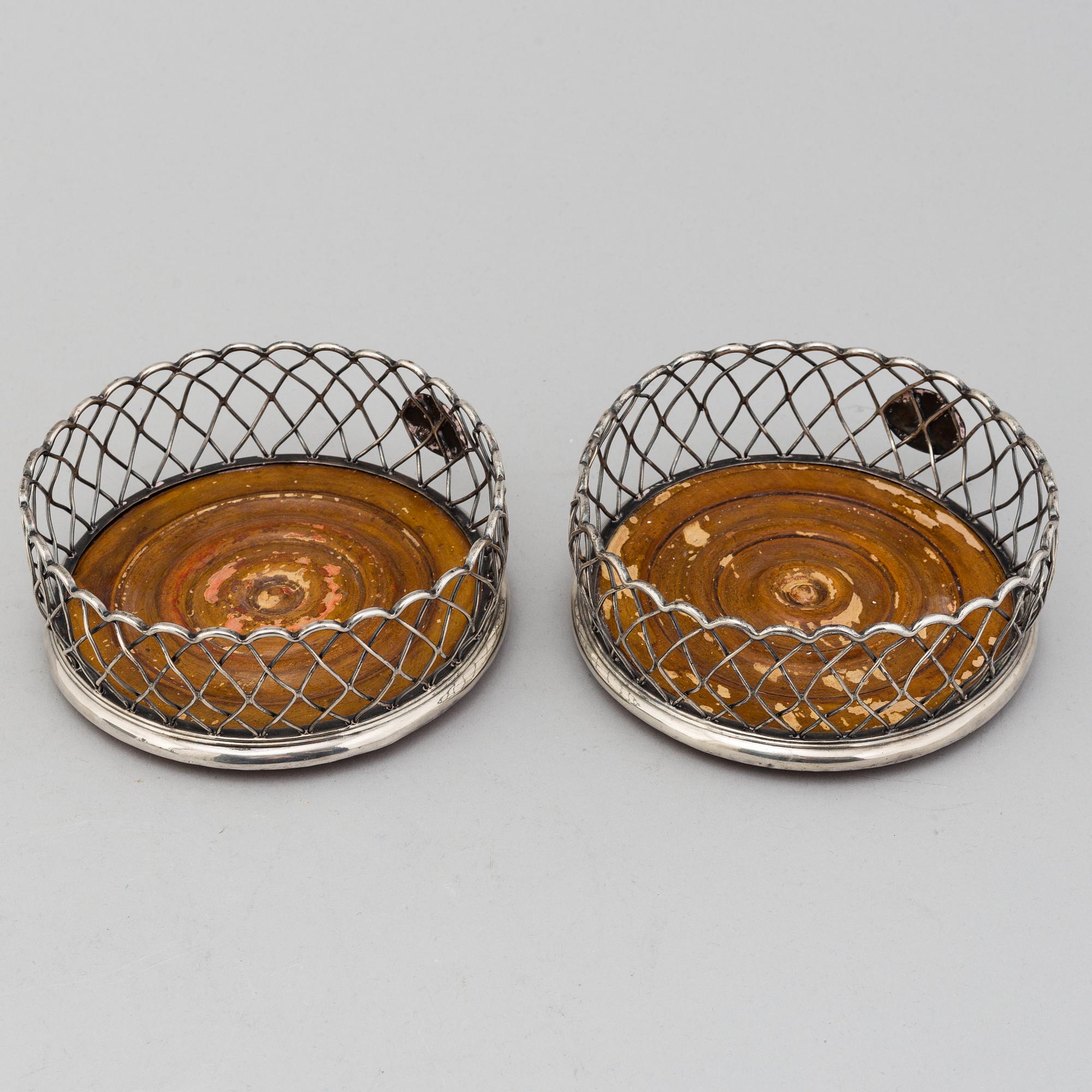 An English pair of 19th century silver plated coasters.