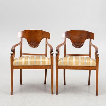 A pair of Swedish Empire mahogany open armchairs, early 19th century.