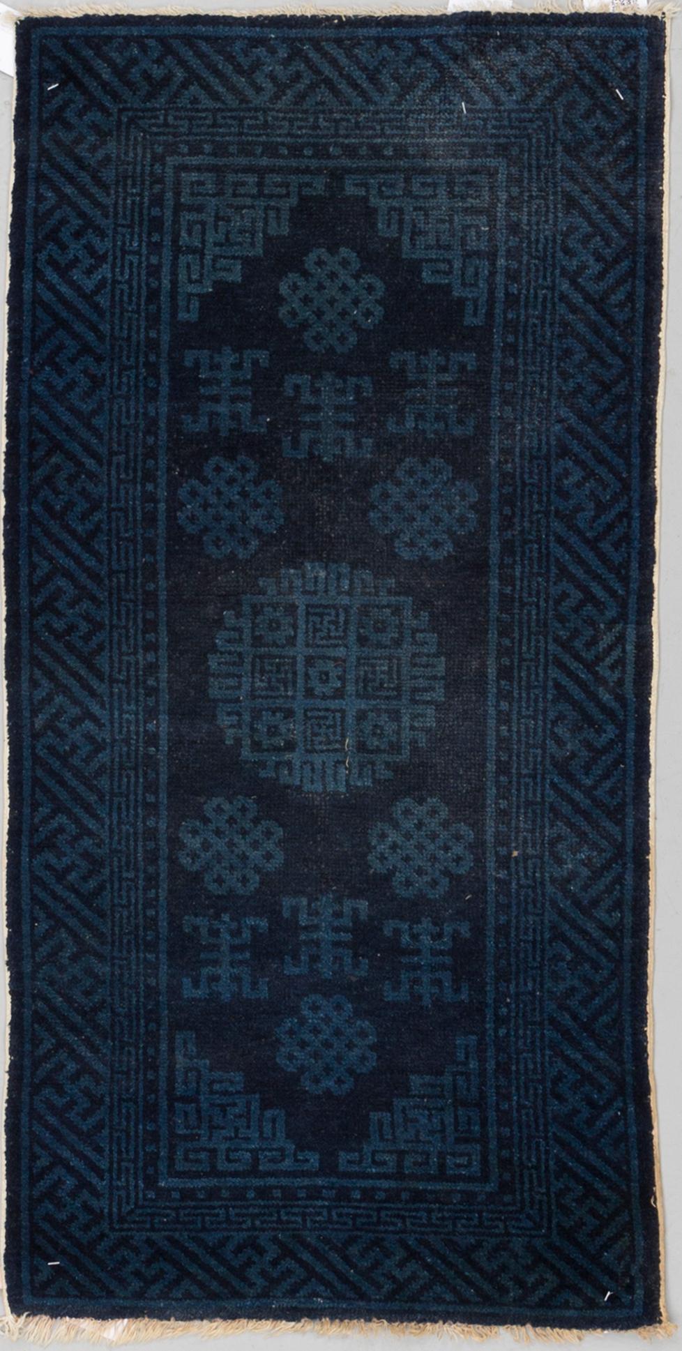 A RUG, a semi-antique Baotou, ca 108 x 54,5 cm.