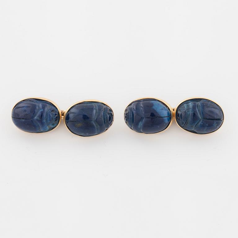 A pair of carved lapis lazuli cufflinks.