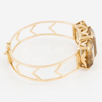 Bracelet 18K gold with faceted quartz.