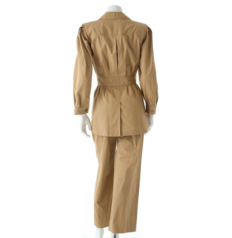 YVES SAINT LAURENT,a two-piece beige cotton dress consisting of jacket and pants, from the Safari collection s/s 1968.