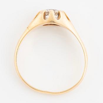 Ring, with faceted white stone.