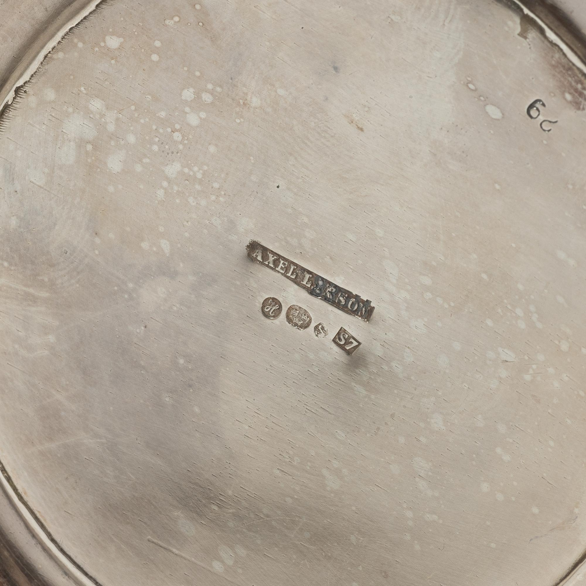 A silver coffee pot, creamer and sugar bowl, import marks of Axel Larson, Helsingborg 1920.