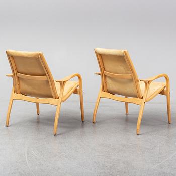 A pair of Laminett Yngve Ekström chairs.