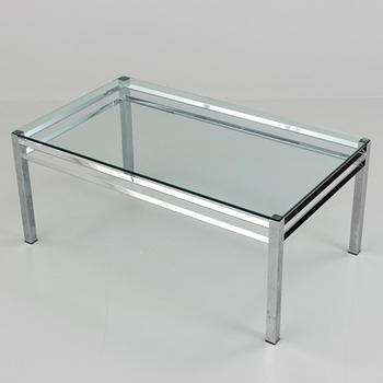 A 1980´s metal table with glass top.