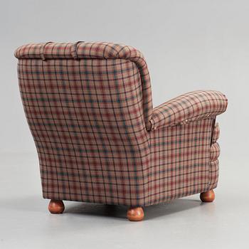 Josef Frank, a 'model 336' armchair, by Svenskt Tenn, Sweden.