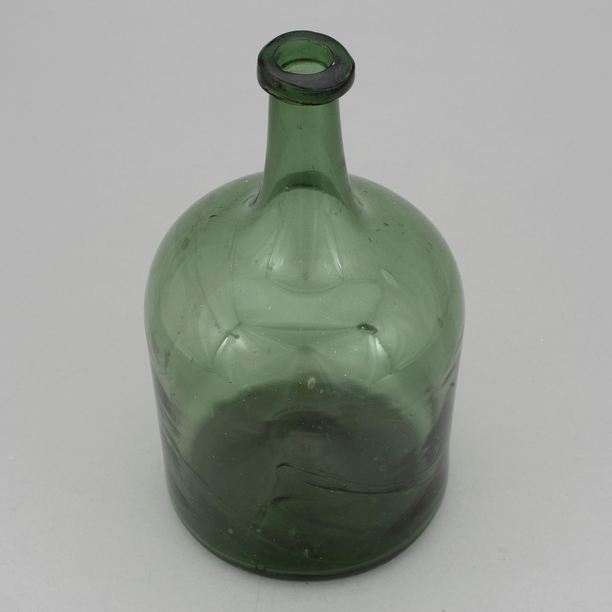A 18th or 19th century glass bottle.