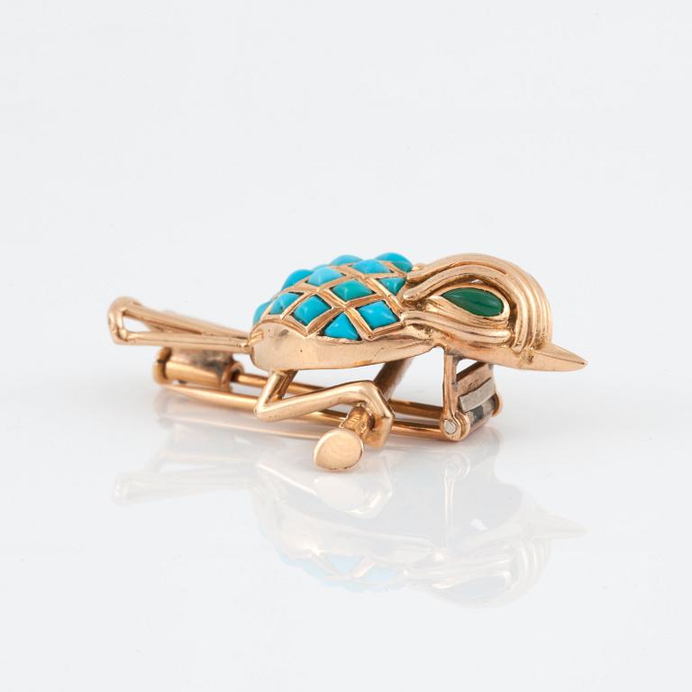 A Mauboussin gold and turquoise brooch.