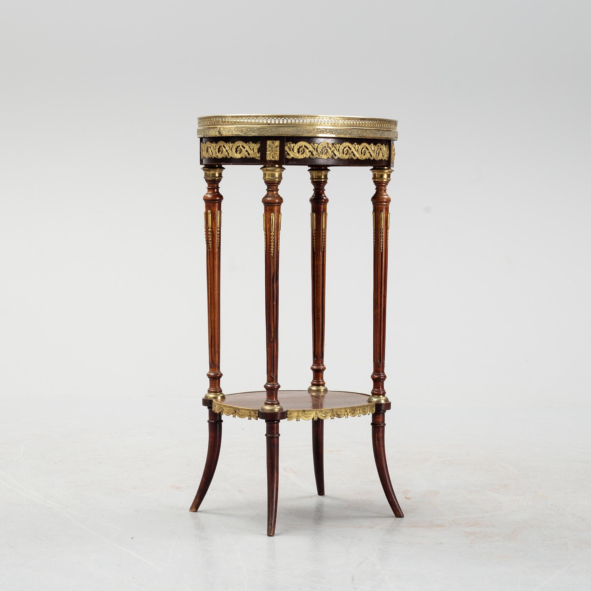 A French Louis XVI-style table, first half of the 20th century.