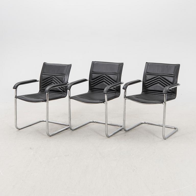 A set of five chrome and leather armchairs alter part of the 20th century.
