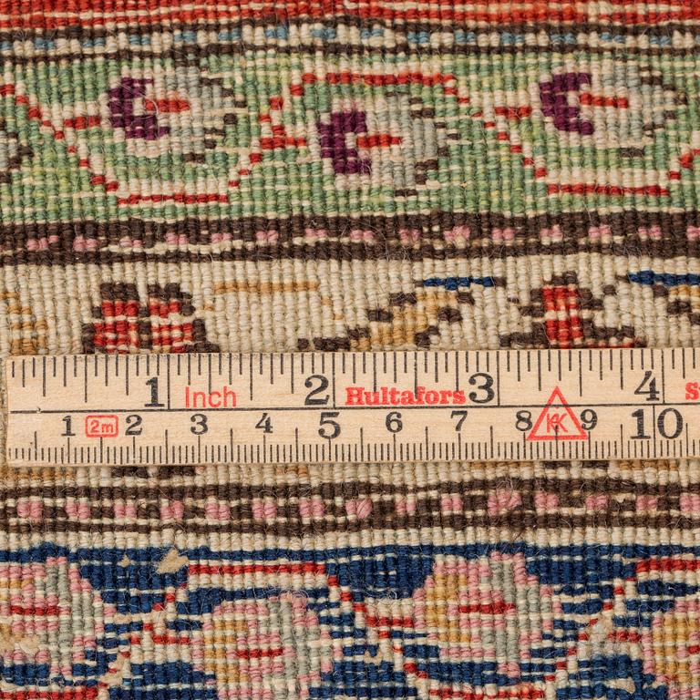 A CARPET, a semi-antique Tabriz, around 422 x 310 cm.