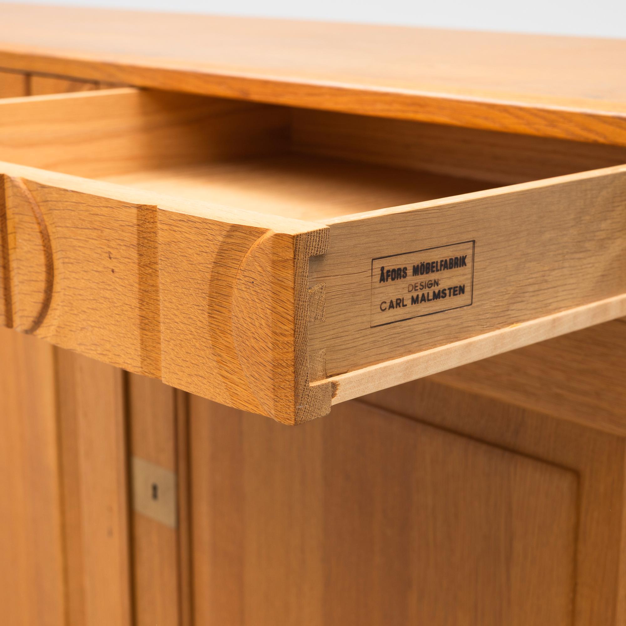 Carl Malmsten, A sideboard "Calmare nyckel", second half of the 20th century.