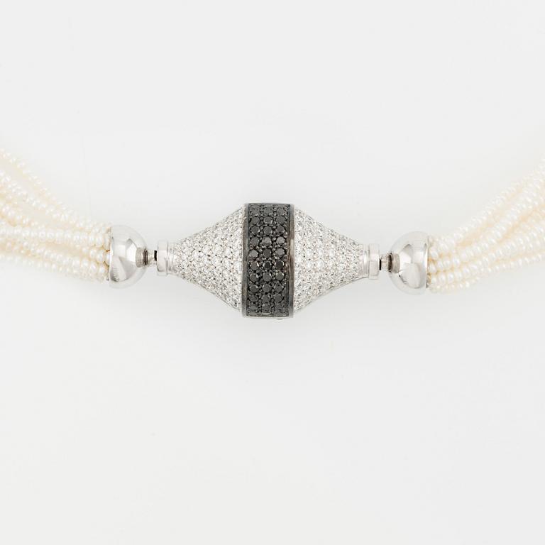 Gaudy lås 18K vitguld med vita och svarta diamanter.
