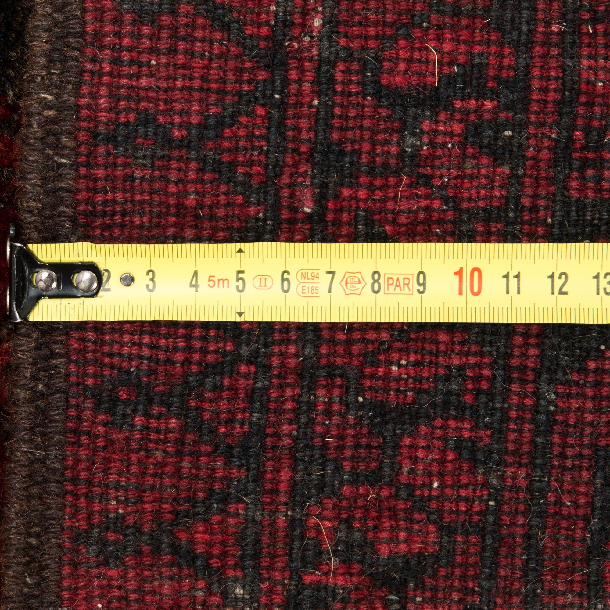 A semi-antique Afghan rug. Ca. 194x152 cm.