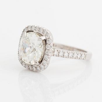 A platinum ring set with a cushion formed old-cut diamond 3.39 cts J vs1 according to accompanying HRD-certficate.