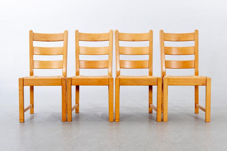 A set of four wicker and oak 1970s chairs.