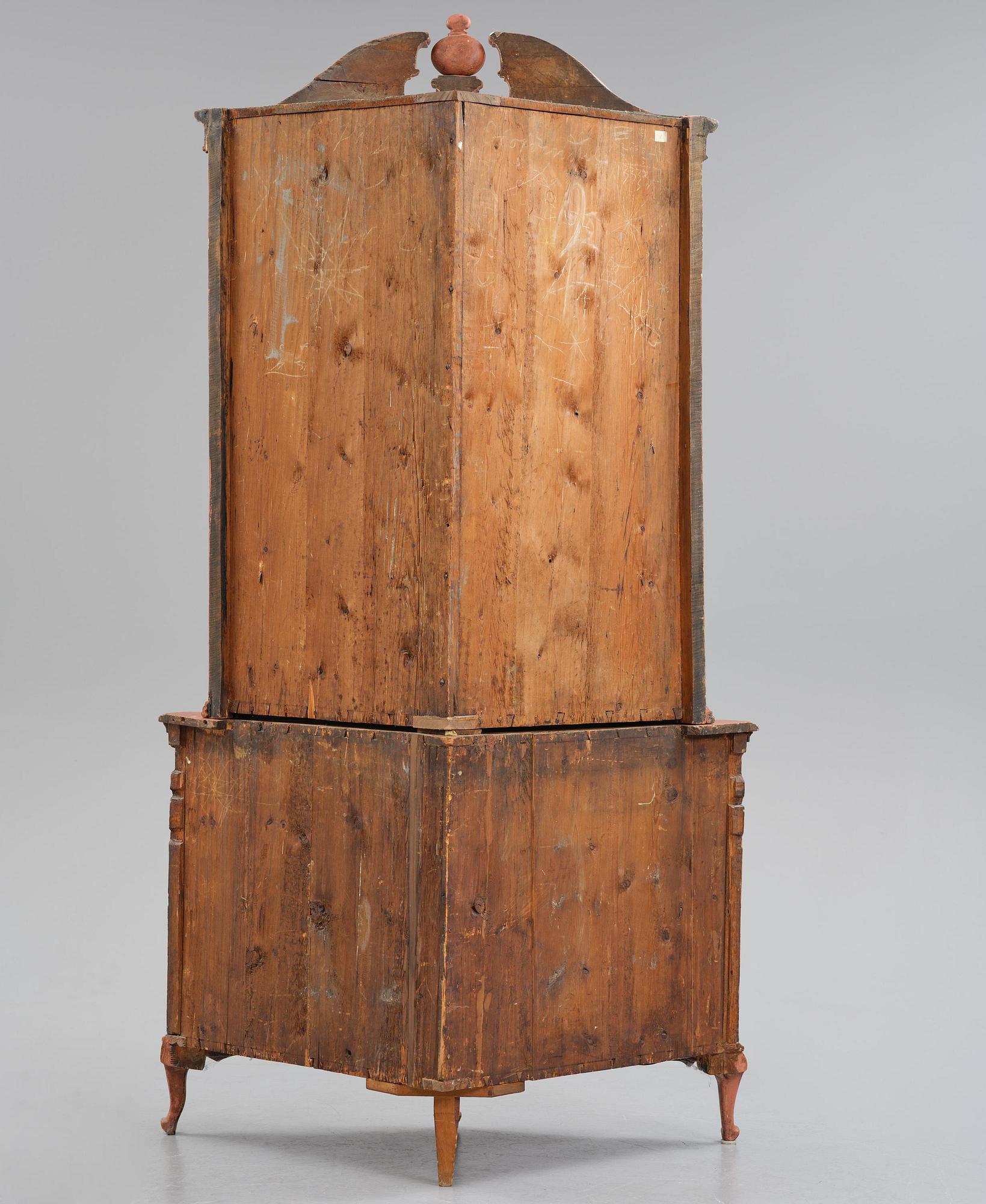 A rococo corner cabinet, later part 18th century.