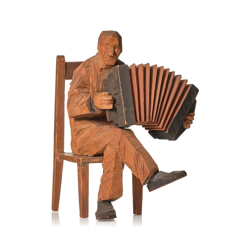 Axel Petersson Döderhultarn, Seated accordionist.