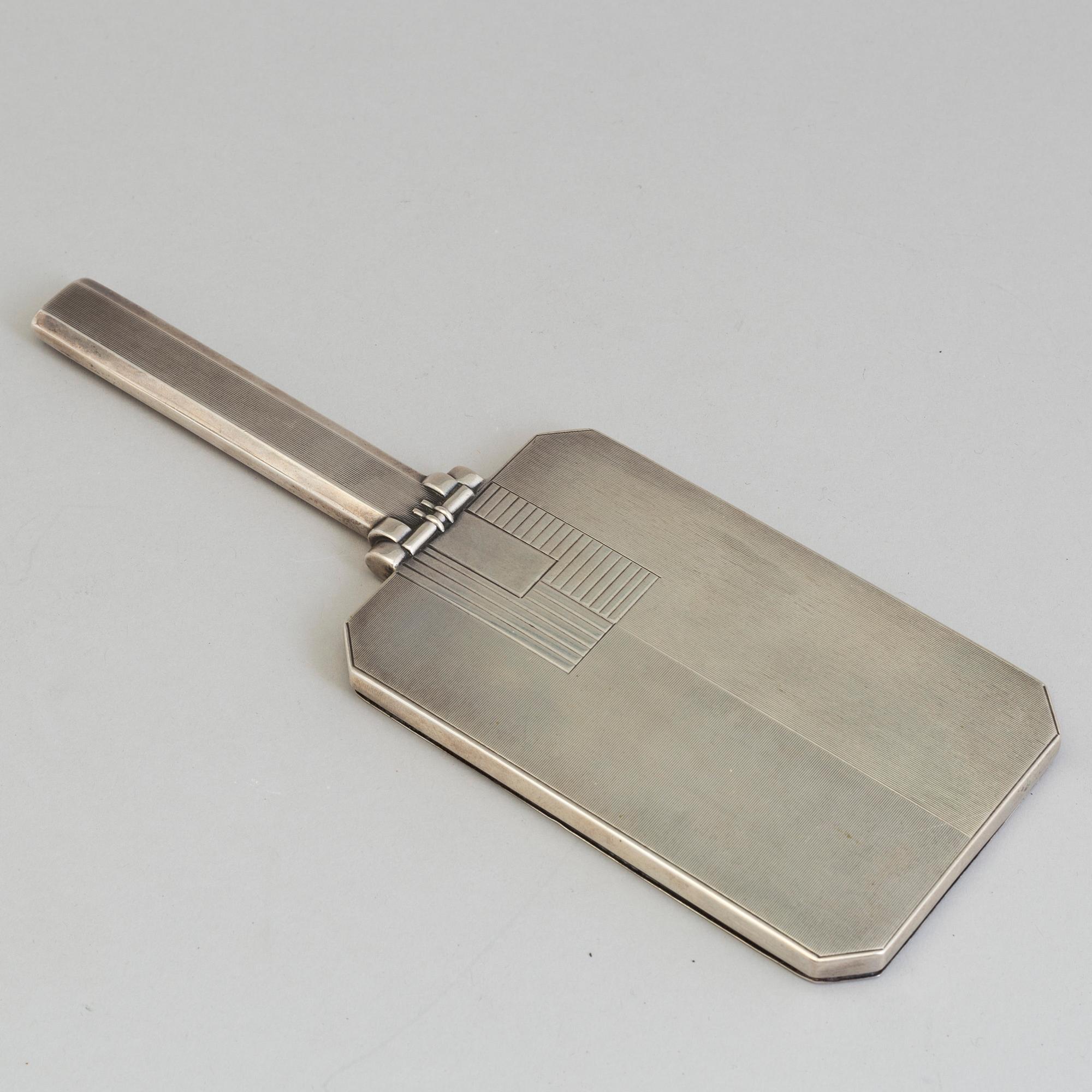 A 1920s / 30s Art Deco silver hand mirror.
