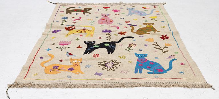 A hand-embroidered Kelim rug, 180 x 122 cm.