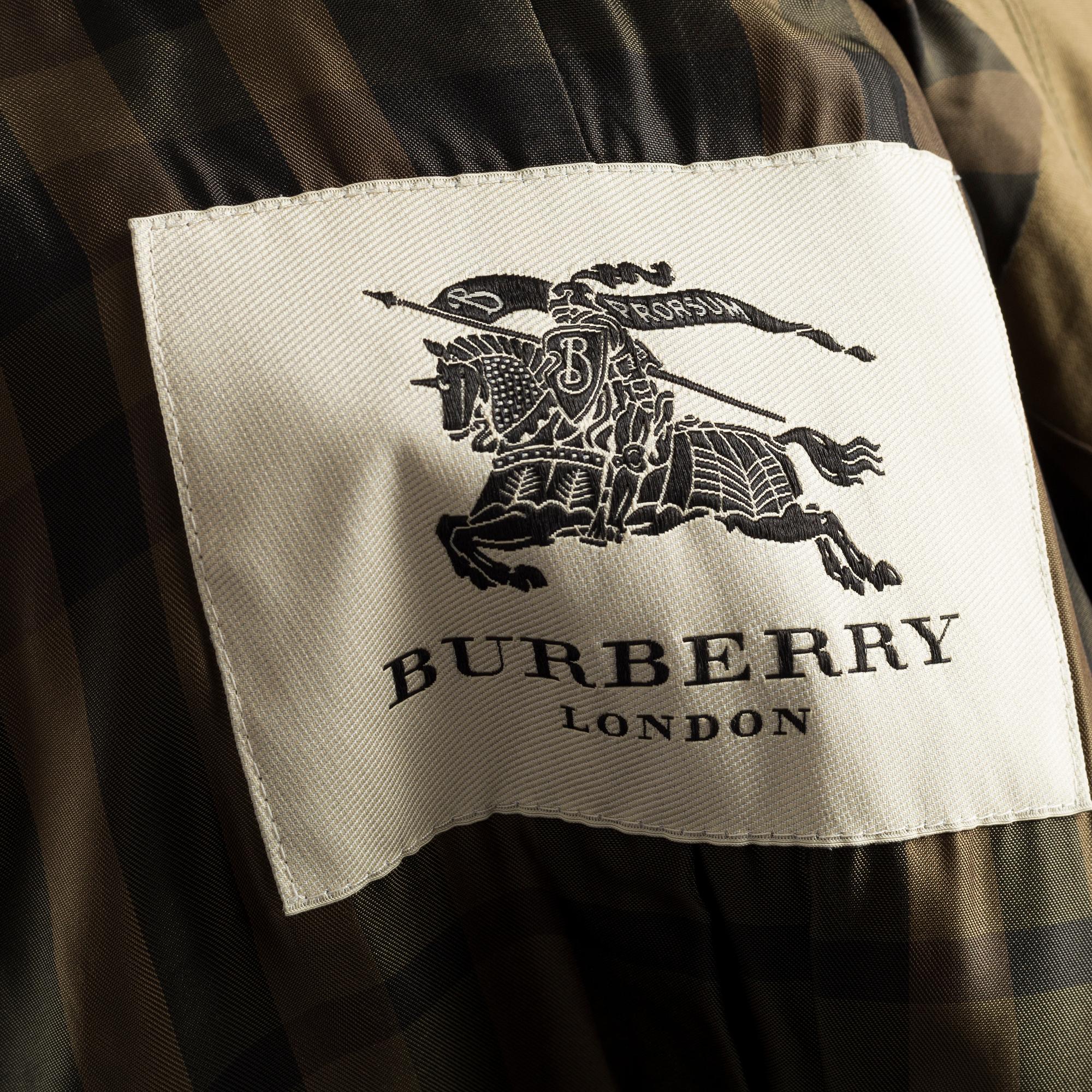 A green trenchcoat by Burberry.