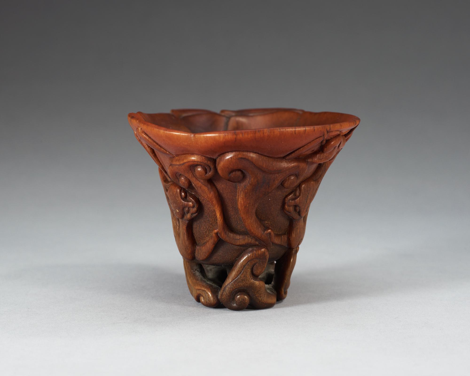 A finely carved rhinoceros libation cup, Qing dynasty, Kangxi (1662-1722).