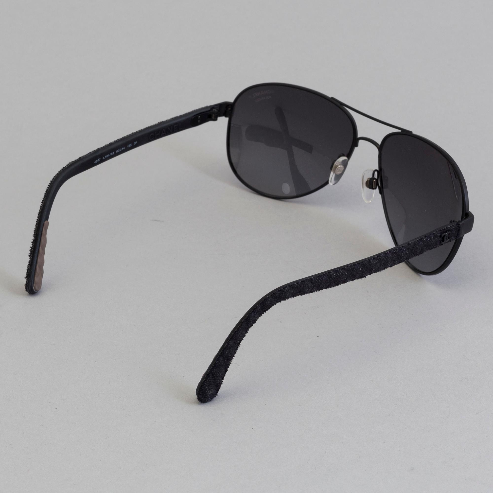 Chanel black pilot summer glasses.