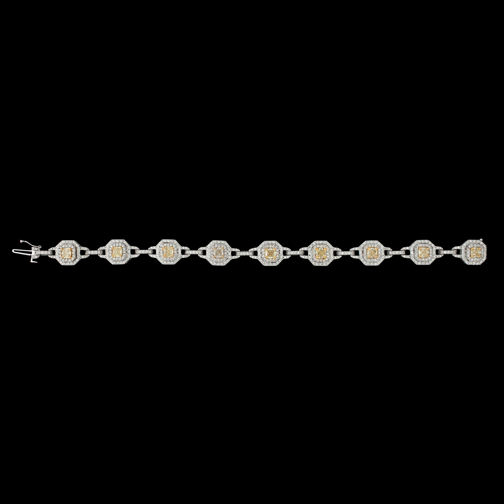 ARMBAND, vita briljantslipade och nio 'fancy' gula radiantslipade diamanter, tot. 2.70 ct, resp. tot. 4.07 ct.