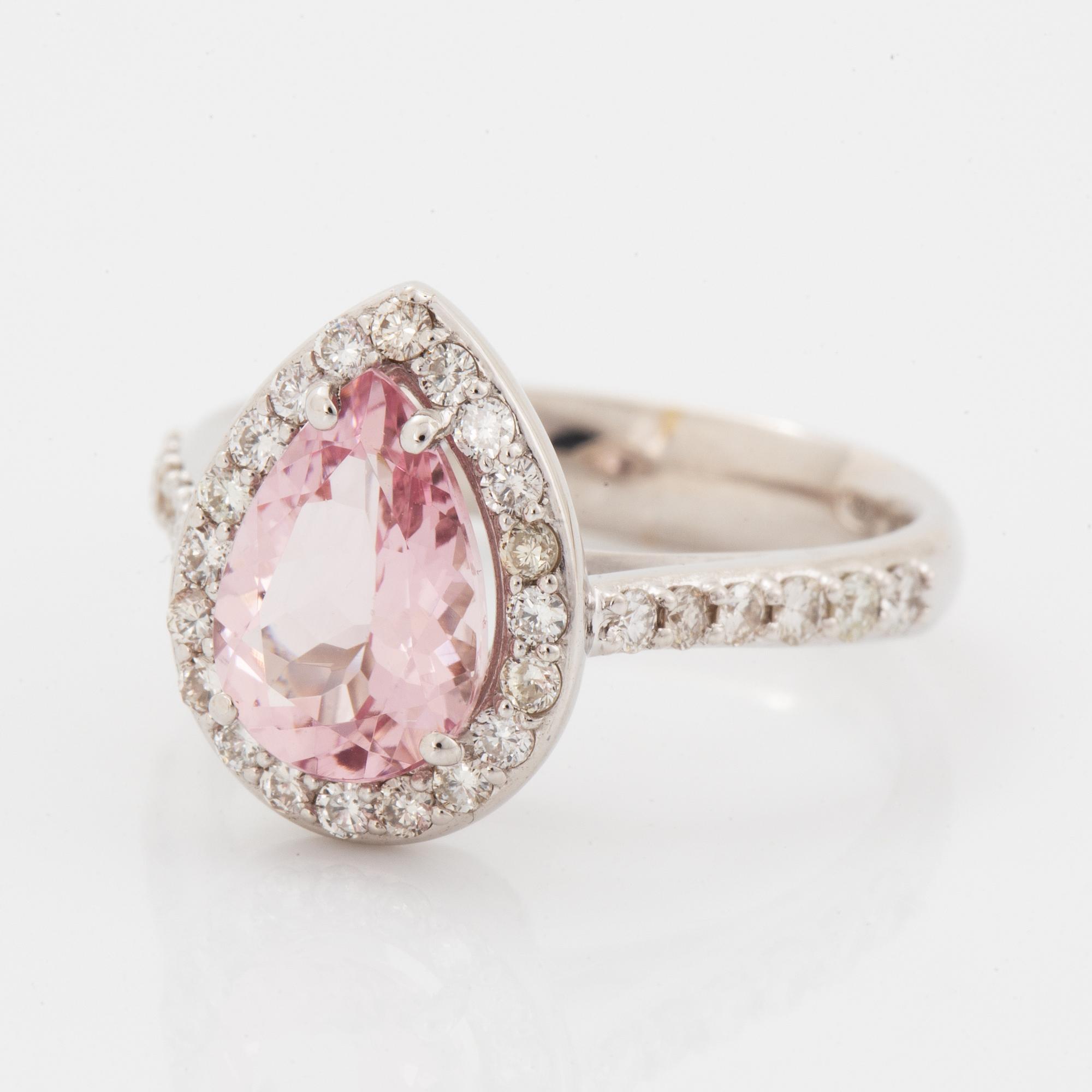 An 18K gold ring set with a faceted morganite.