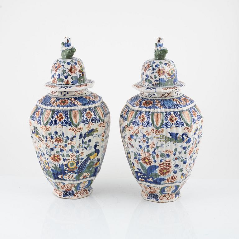 A pair of faience urns with covers, Holland, 19th / 20th Century.