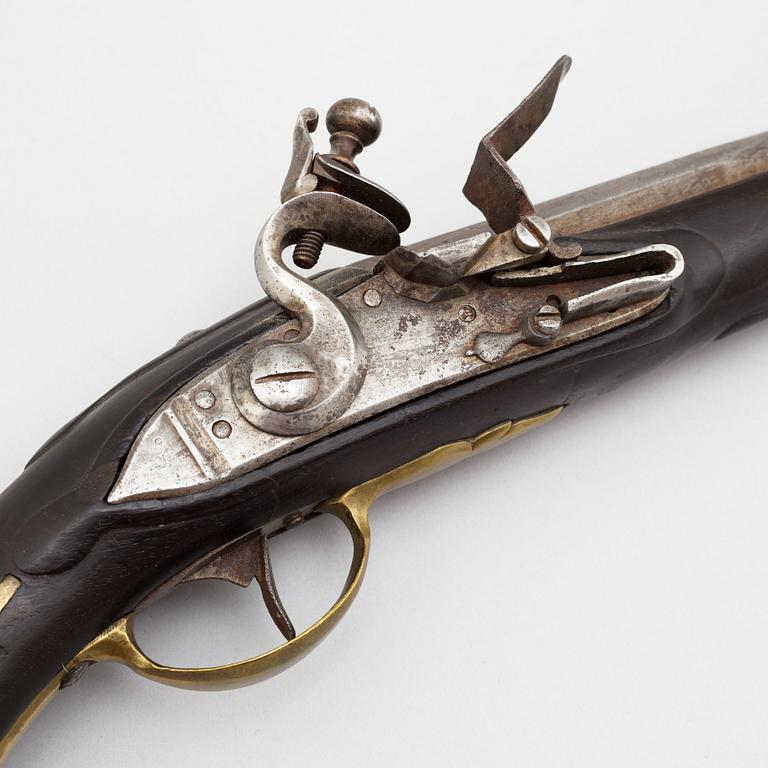A 18th century flintlock pistol.