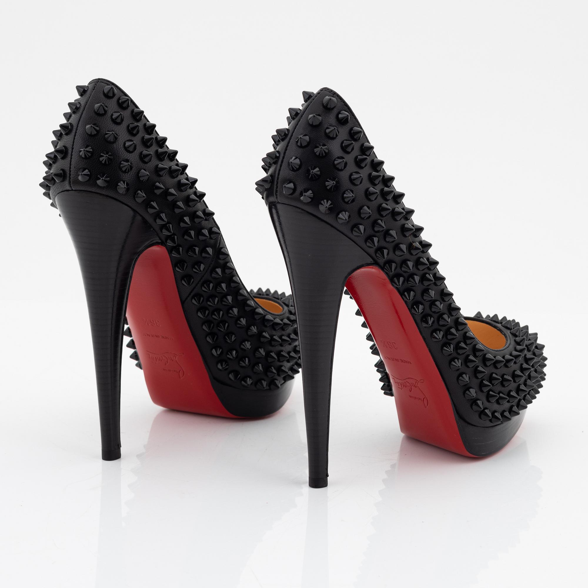 Christian Louboutin, a pair of black leather and studs pumps
