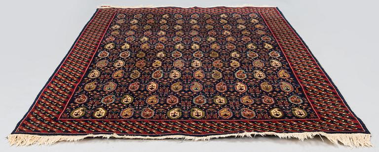 A signed rug, Hereke, Turkey, 184 x 119 cm.