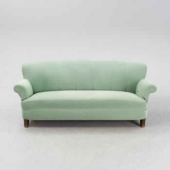 A mid 20th Century sofa and easy chair.