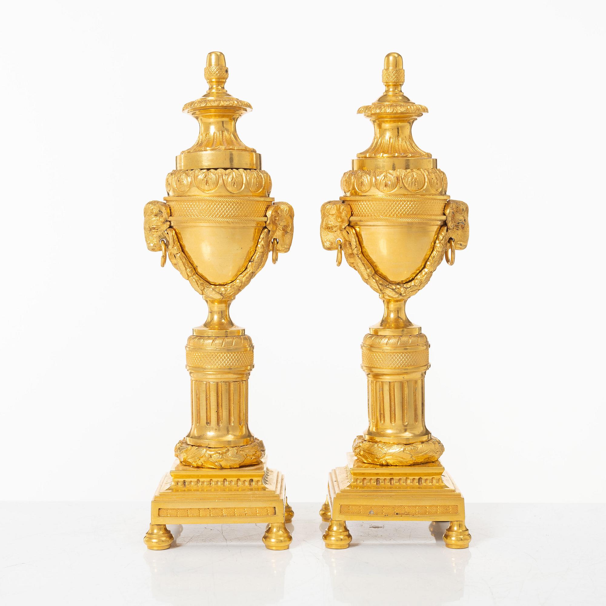 A pair of French Louis XVI style gilt-bronze casolettes, later part 18th century.