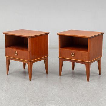 A pair of teak veneered bedside tables, mid 20th century.