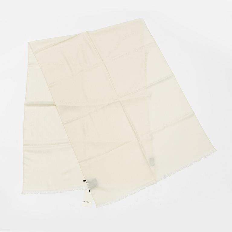 Gucci, a wool and silk mix "GG" jaquard shawl.